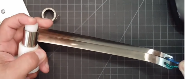 Variable force spring for shelf pusher systems providing smooth and controlled pushing force spring