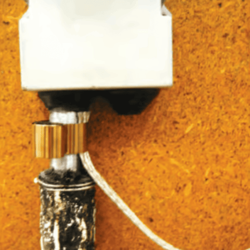 Stainless steel constant force spring for grounding, cable screening, and earthing applications in industrial systems.